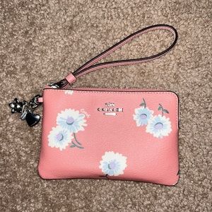 Pink coach wallet with white flowers and charms